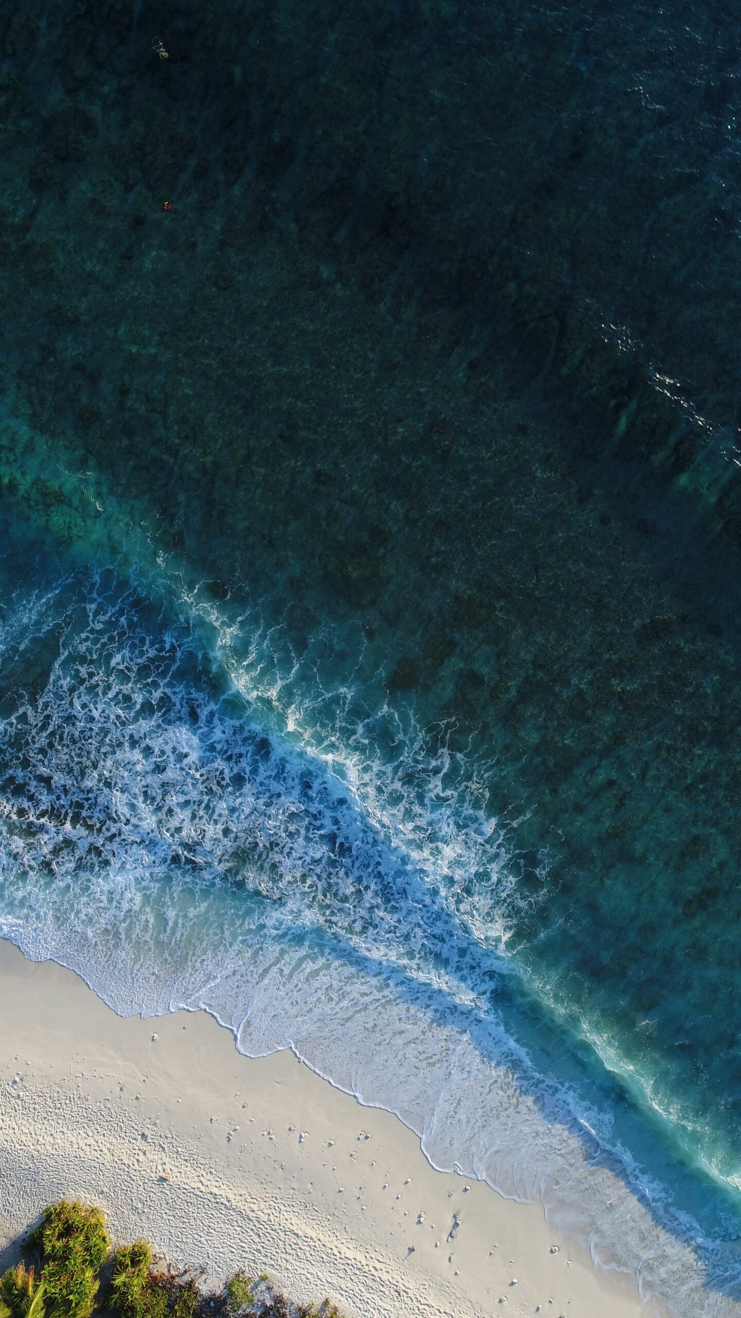 turquoise calm sea wave splashing on white sand beach aerial photography